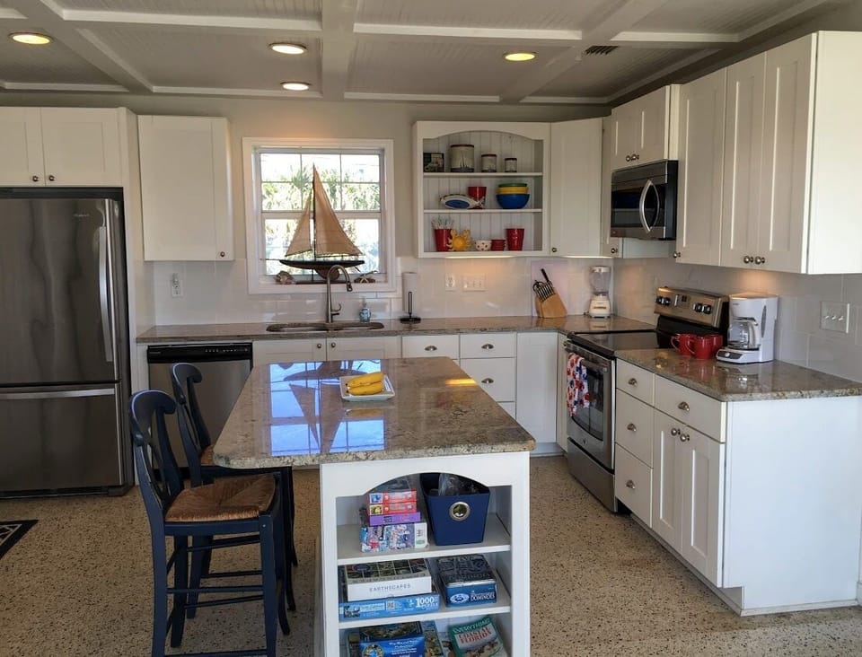 Fully Equipped kitchen with stainless appliances and Granite Counter Tops. 