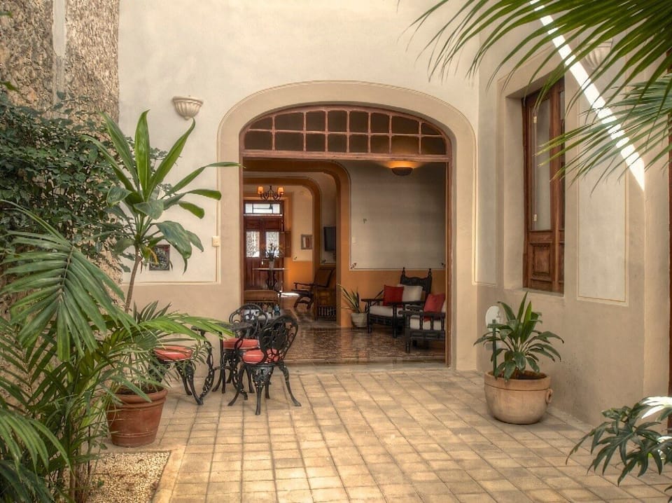 Enjoy breakfast at the cafe table in the central courtyard