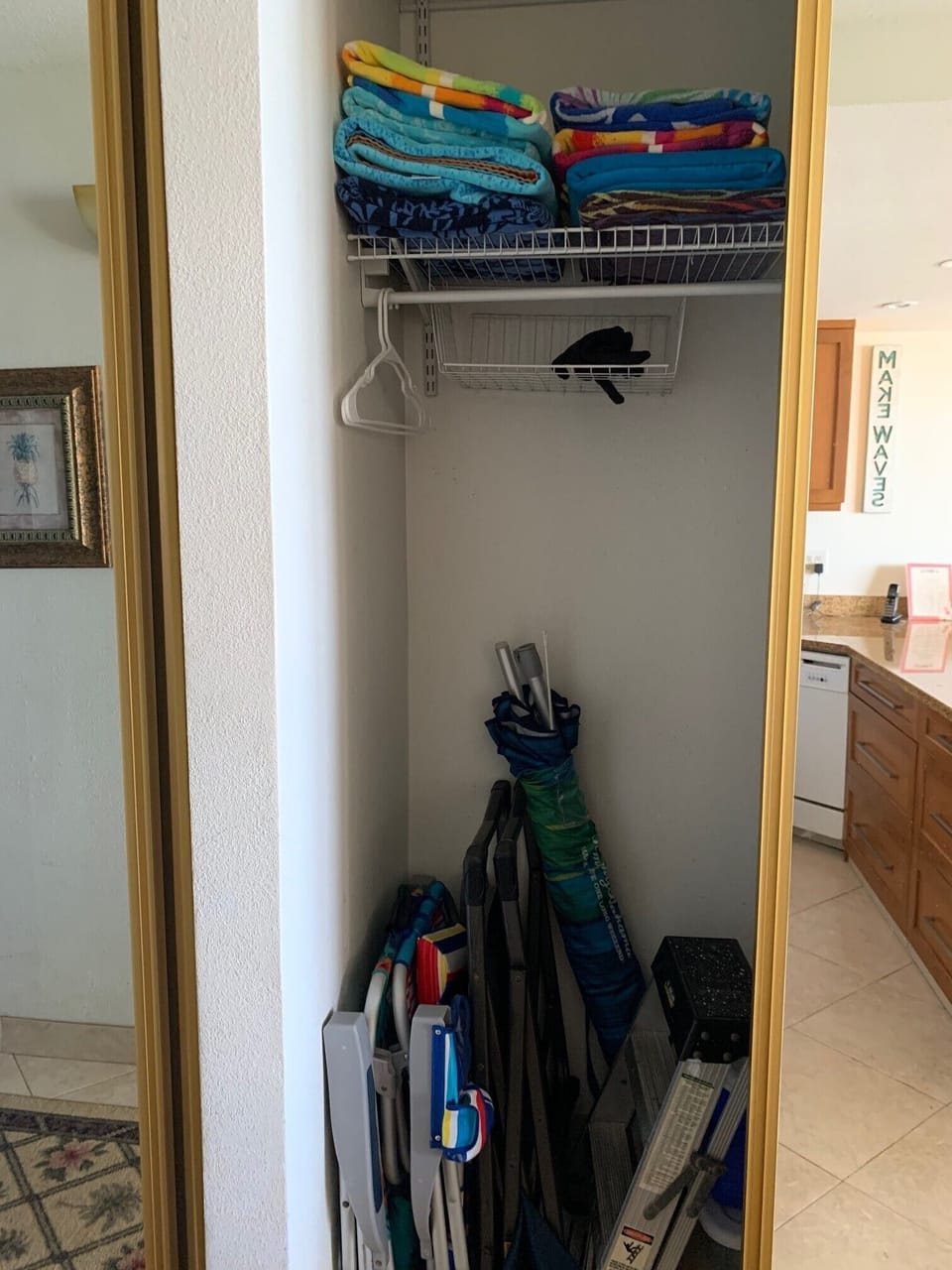 Beach towels and beach chairs in hall closet.