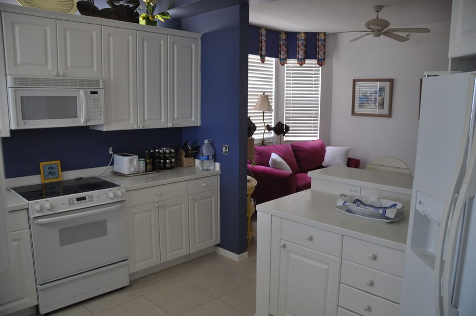 Kitchen opens to sitting room with sleeper couch.