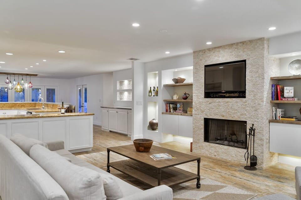 Living room: open, spacious, direct TV, DVD collection, Restoration Hardware.