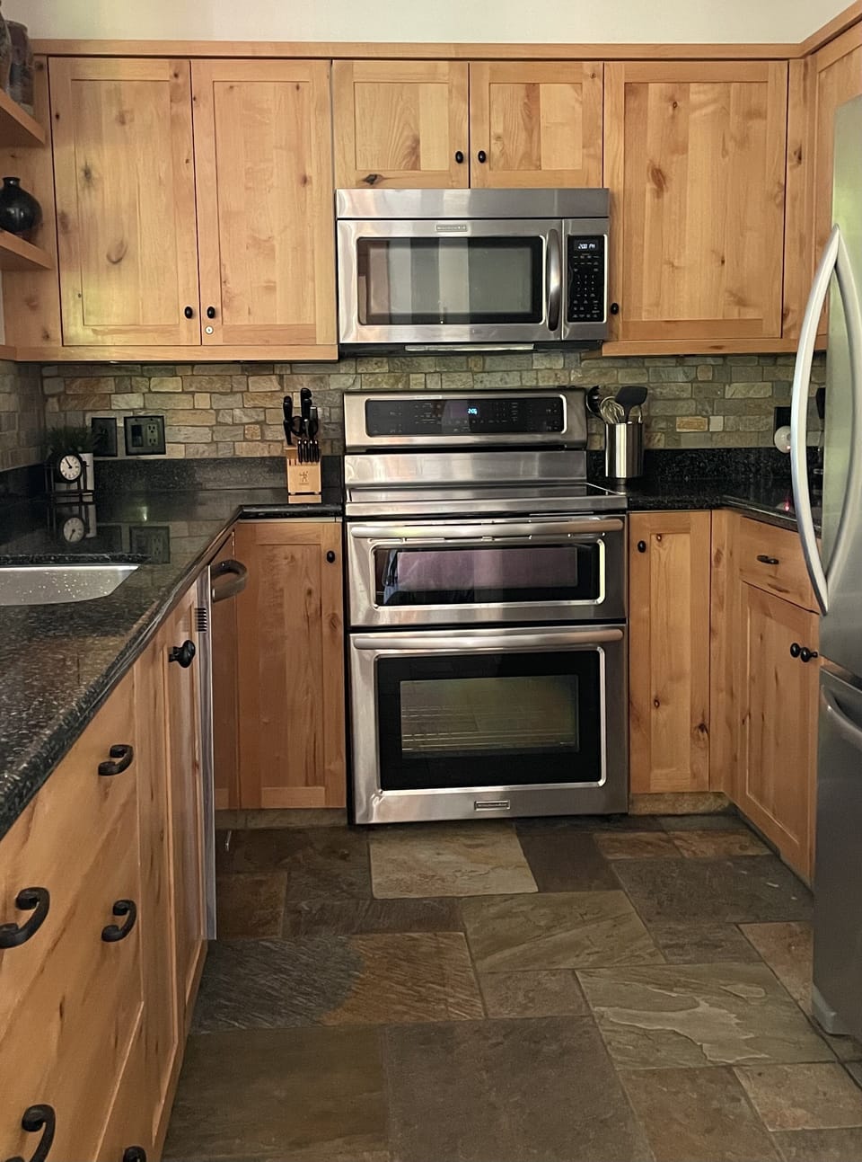 The kitchen has stainless steel appliances.