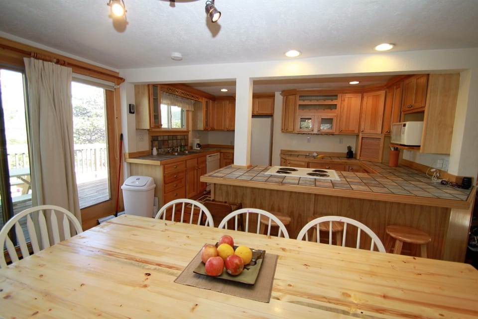 Open-concept floorplan with dining area between kitchen (shown) and living area.