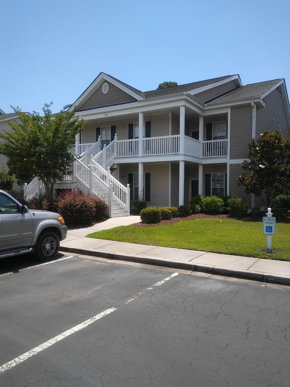 View of front of condo building (my unit is in top/right corner).  Free parking