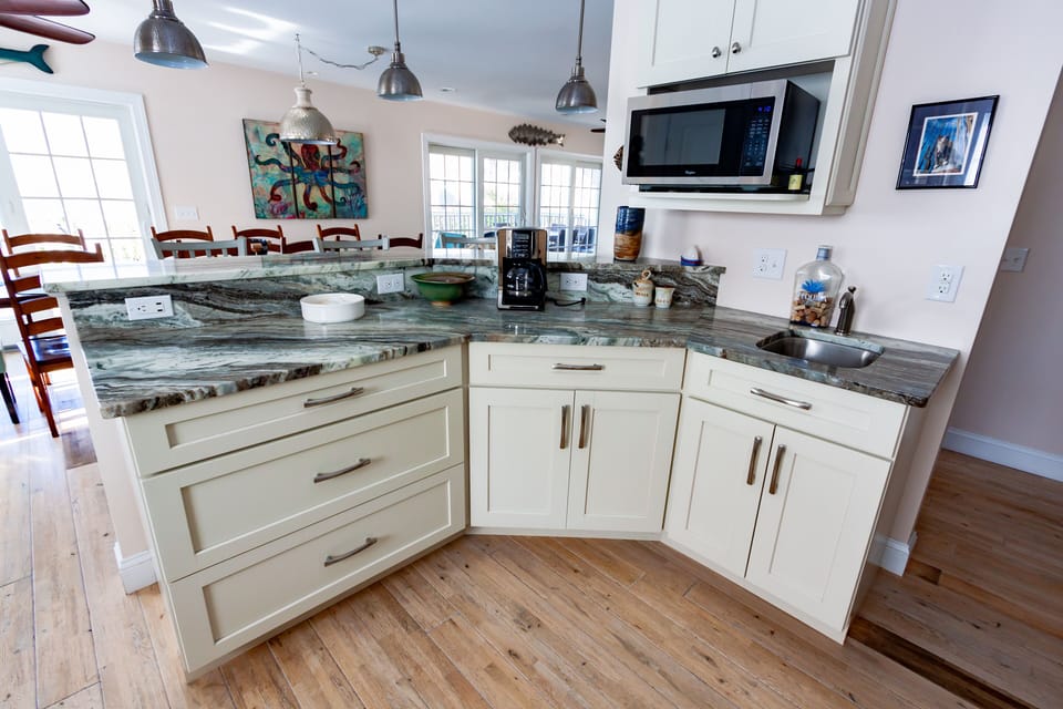 Kitchen island seats three with bar sink