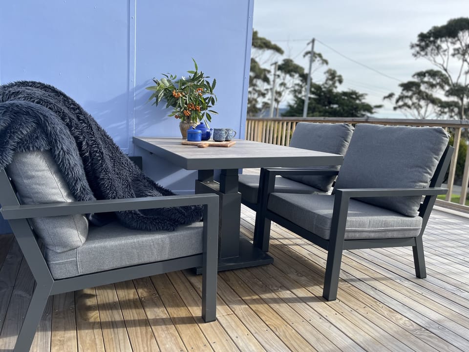 outside dining area in sheltered nook set back for privacy