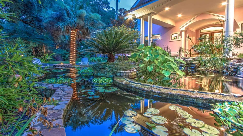 Home has 2 Koi Ponds in Front Yard