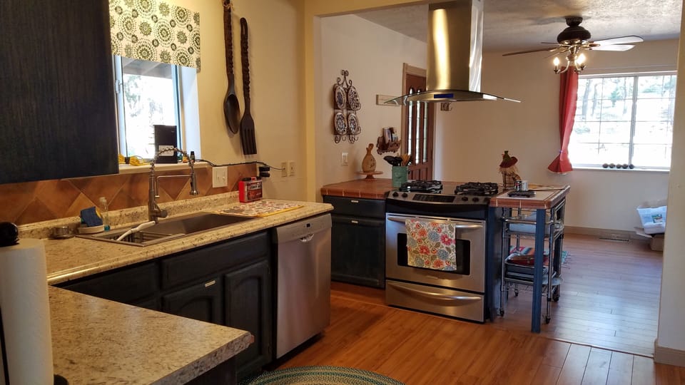 Kitchen, well stocked with Dishwasher, microwave, many staple items