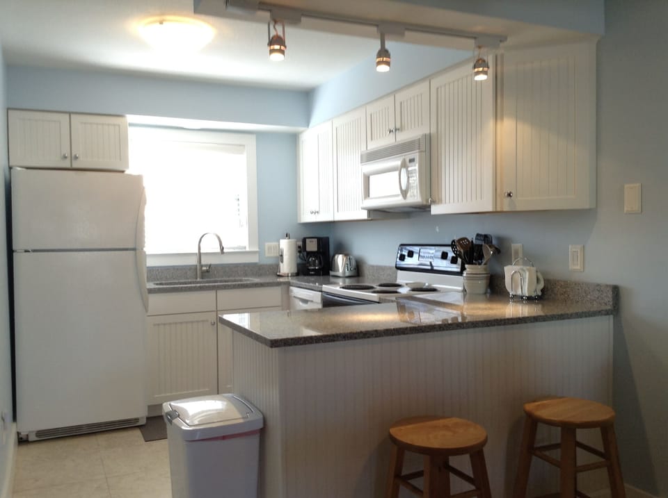 Remodeled kitchen with granite counter tops and new cabinets