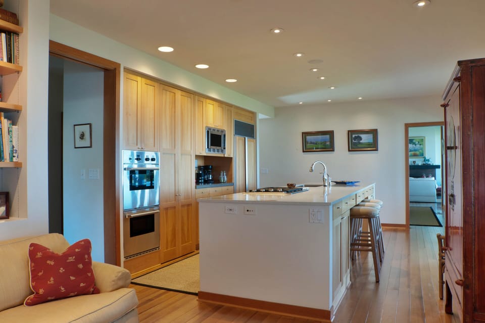 Stove and sink on island to enjoy view