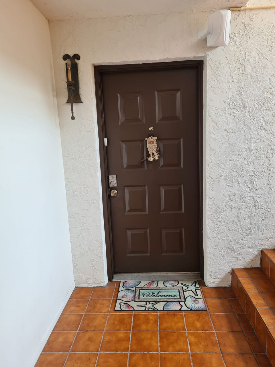 Entry door with Kwikset electronic lock.