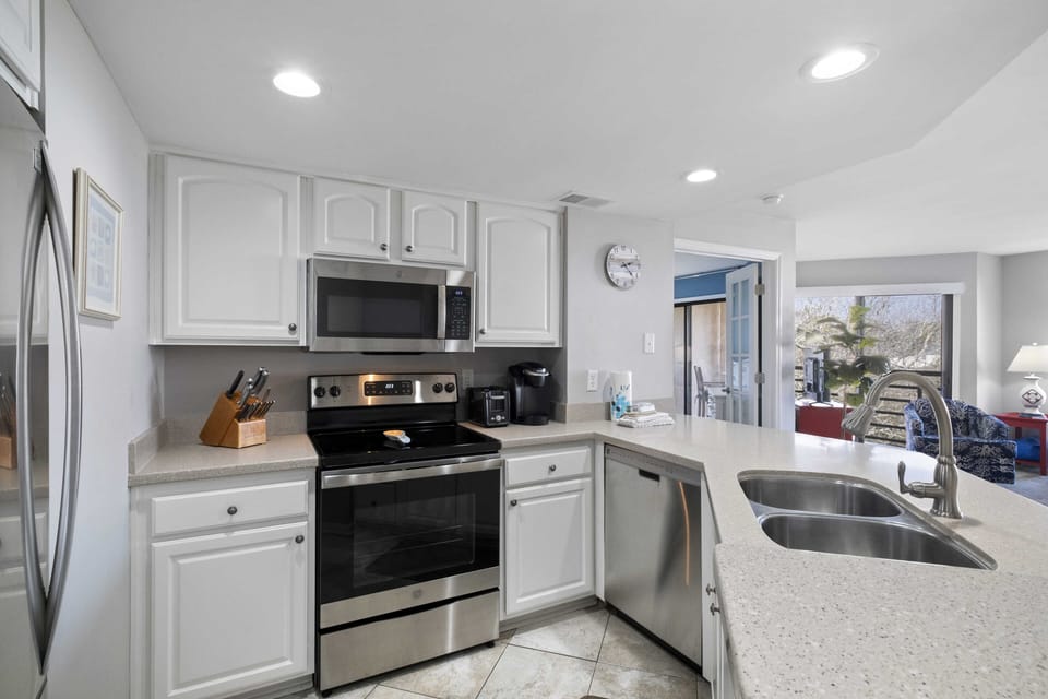 Interior of kitchen, includes Keurig, drip coffee maker, toaster, and Vitamix.
