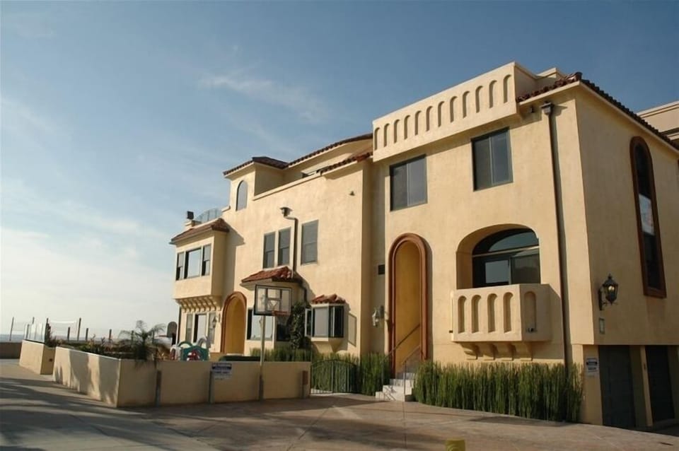 Exterior of Guest Unit which encompasses from the tall skinny arch back.