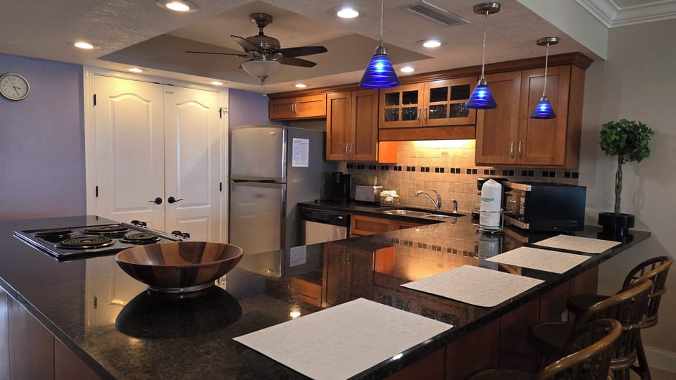 Open kitchen with dimmable, decorative accent lights to set the right mood.