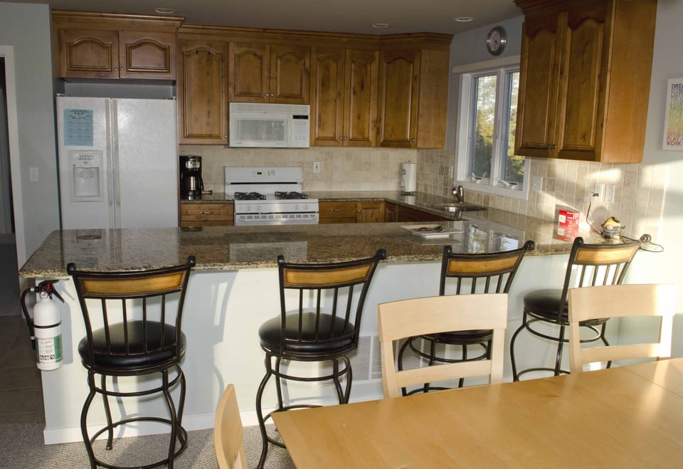 Gourmet kitchen with four counter seats