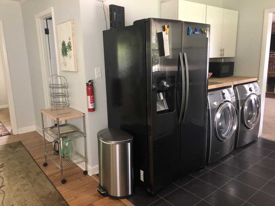 Refrigerator, washer/dryer, microwave with a convenient butcher block counter. 