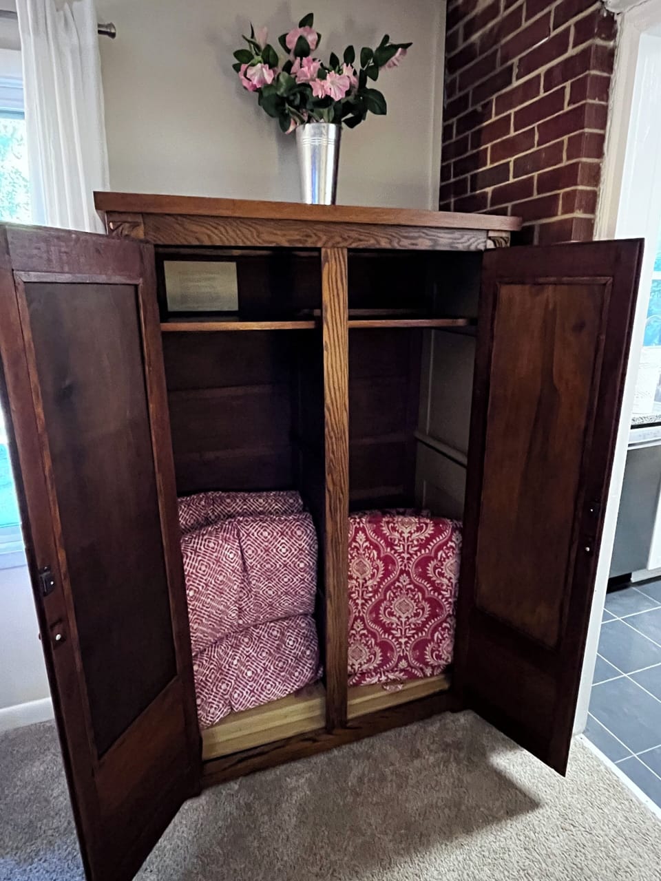 Storage cabinet with cushions for the Adirondack chairs in the backyard.