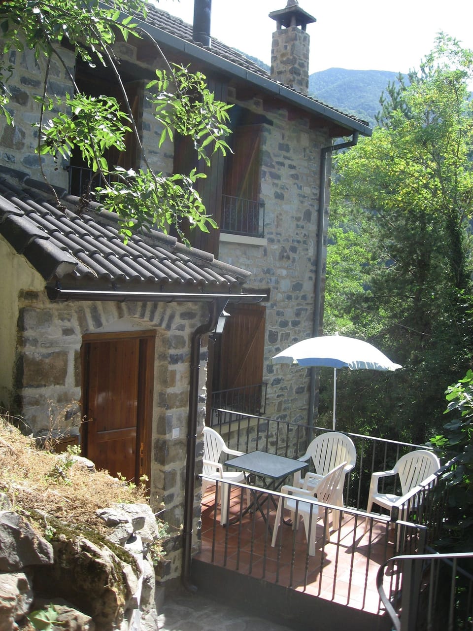 Front of house with sun terrace (trees have since been cut)