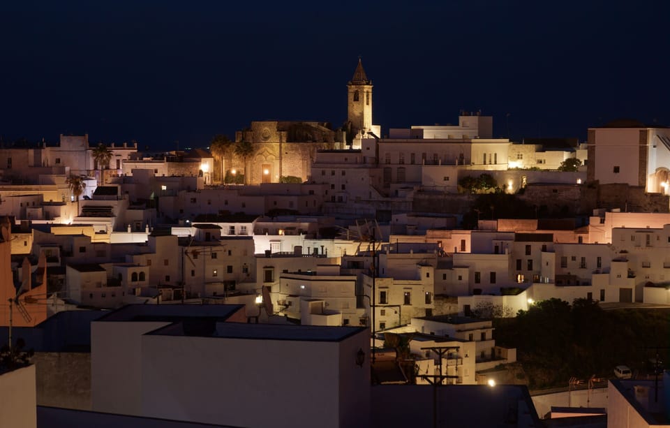 Enjoy a drink on the terrace and watch night fall on Vejer old town.