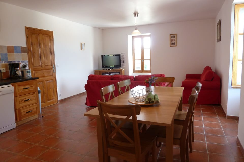 dining area & lounge with tv & sofa bed