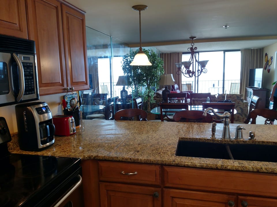 Kitchen view to dining and family room