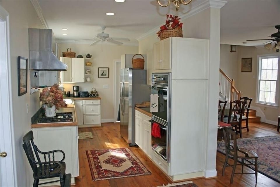 Fully equipped kitchen looking into living/dining great room.