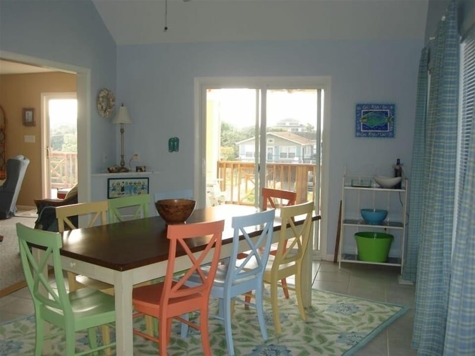 Windows surround breakfast room with seating for 8-12; opens to covered porch