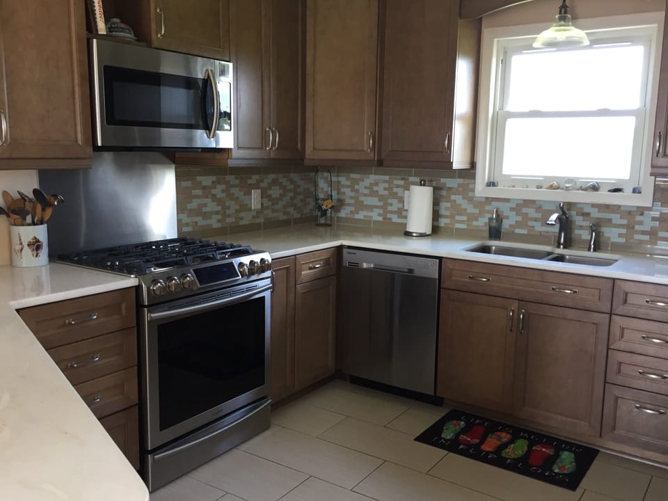 Renovated kitchen with 5 burner gas stove. 
