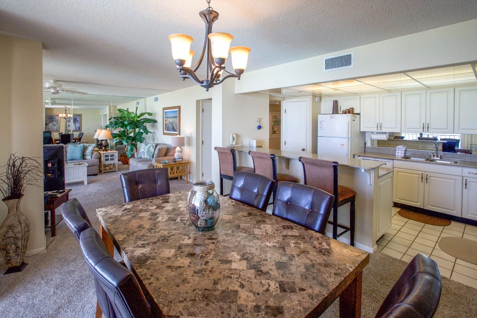 Large dining area with dining table and bar seating