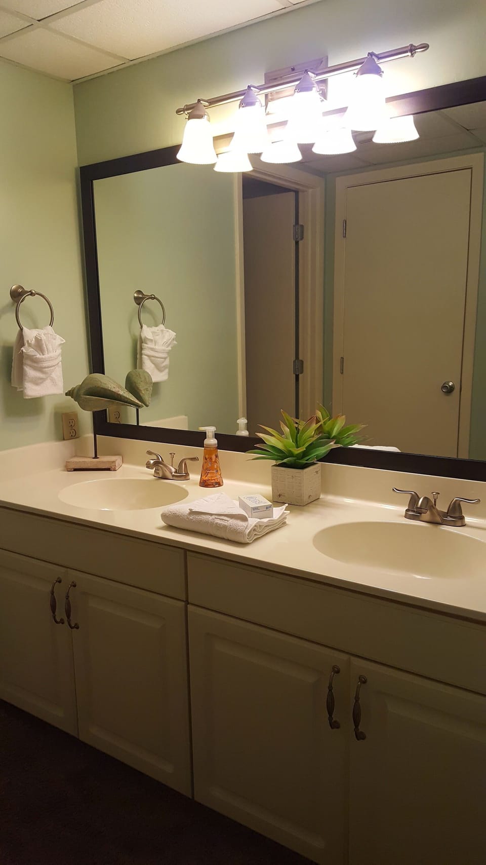 This bathroom has double vanities, separate shower/toilet room, & a walkin close