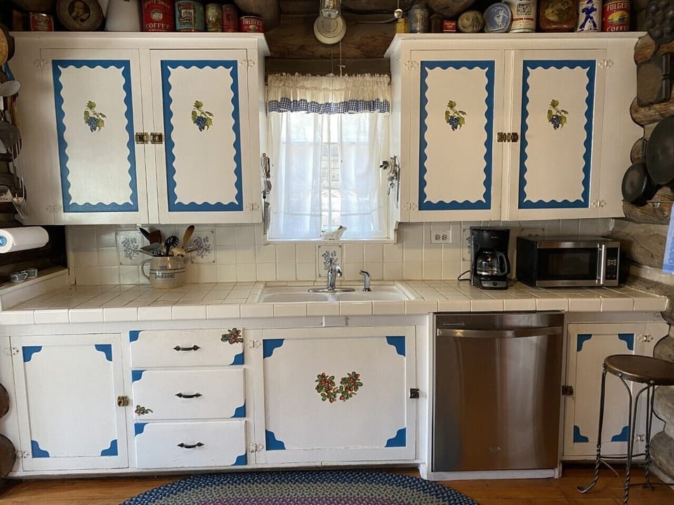 The happy kitchen includes modern appliances. 