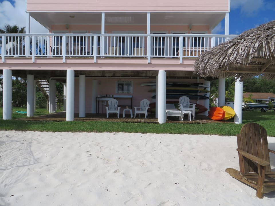 Abaco Palms new beach level covered deck with rack for paddle boards and kayaks.