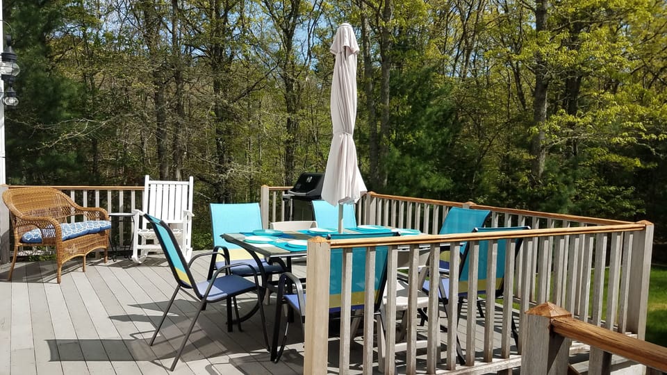 Backyard deck off kitchen/dining area.  Weber grill.