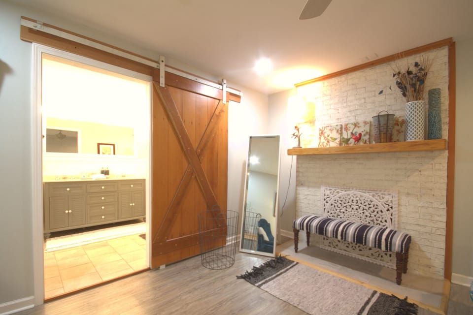 Master bedroom with king-sized bed and en suite luxury bathroom.