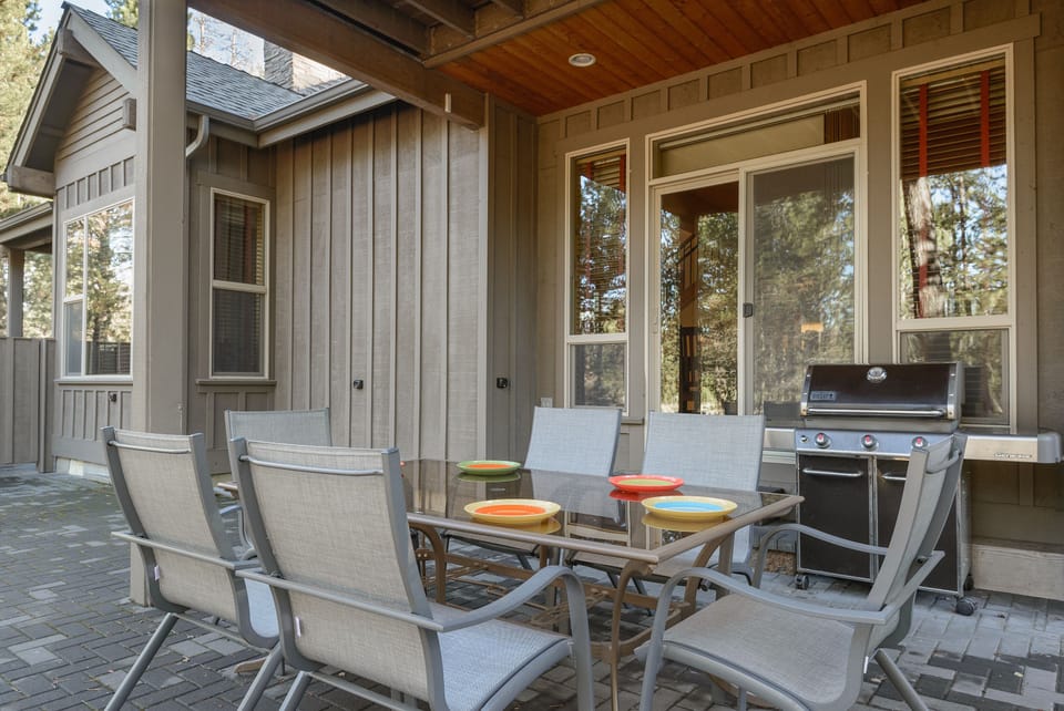 Table and chairs for ten.  Genesis Weber propane grill.  