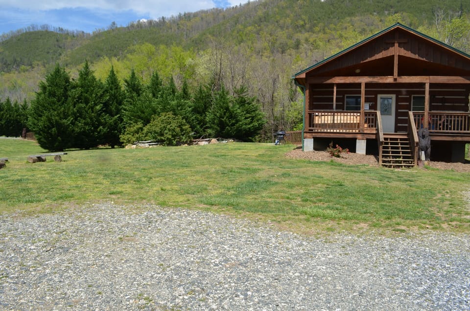 The Rock with a view of the trees that divide the 2 cabins.