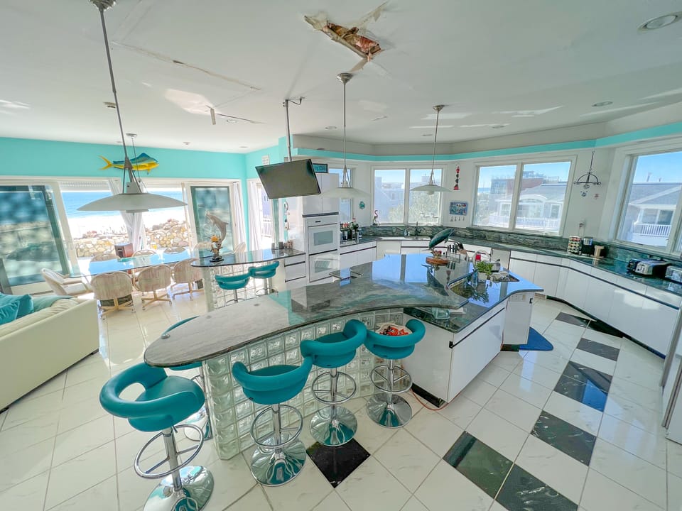 Kitchen with wrap around windows and Ocean View.