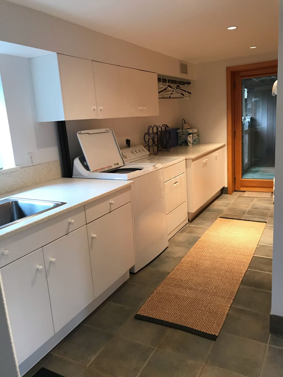 Laundry room. Side door exit leads to outdoor shower (entry level)