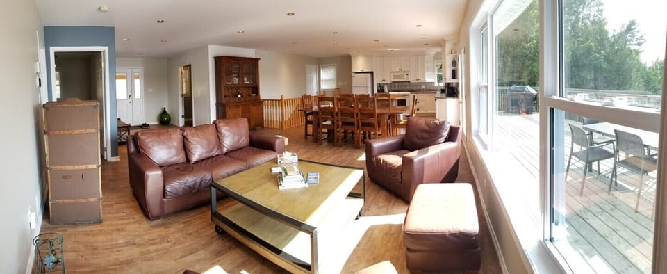 Open concept with large windows overlooking lake and walk out to 50 foot deck
