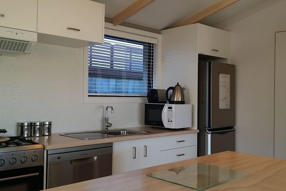 Self contained Kitchen
Laundry in cupboard
Nescafe Coffee Pod machine