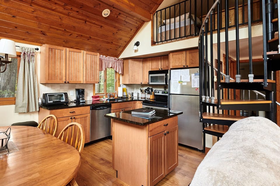 Beautiful wood tones complemented by stainless appliances and granite counters.
