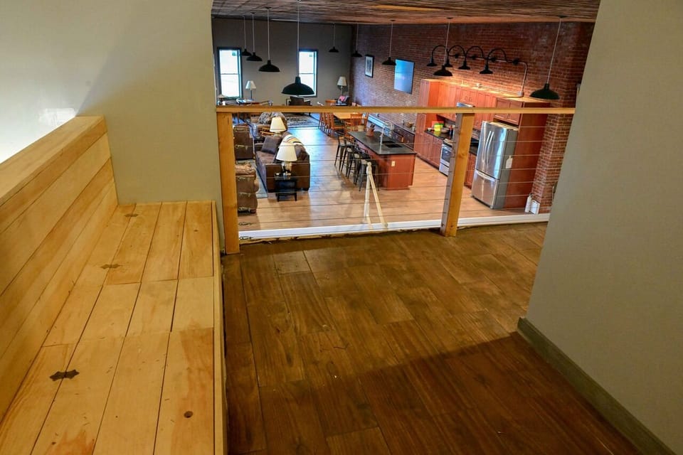 Seating & storage area with a view of the grand view from the balcony! 
