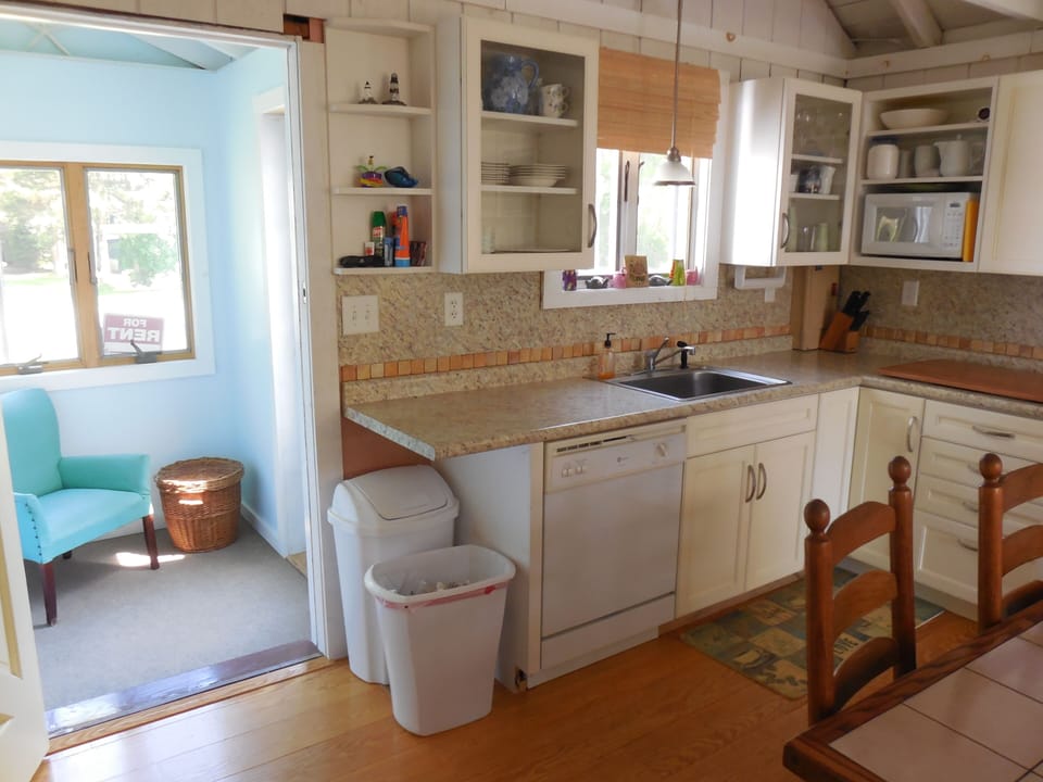 Front entrance, kitchen dishwasher.