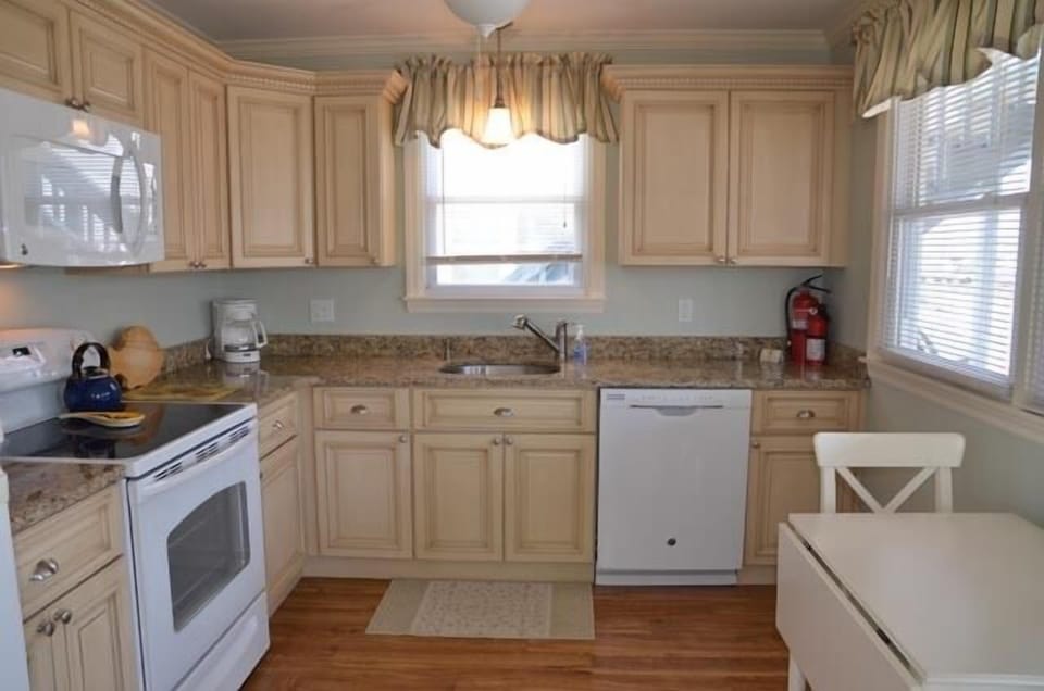 1st floor - spotless kitchen with new appliances and  granite counter tops.