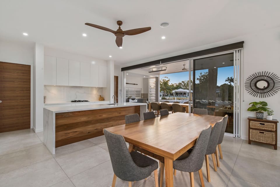 Kitchen/Dining room open to waterfront patio. 