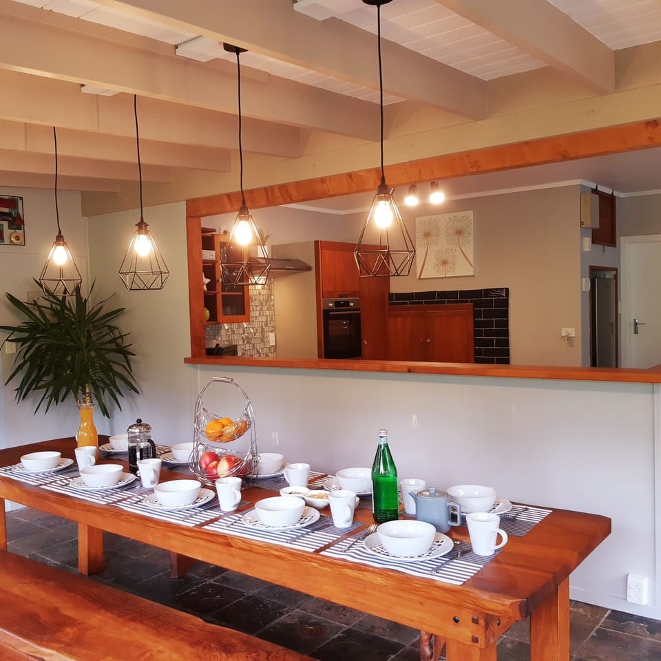 Large dining room table, seats 10 people, opens up to kitchen&lounge area.