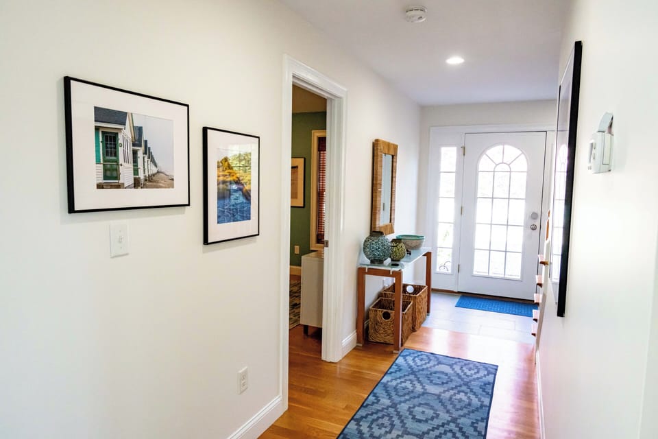 Looking towards front door - 1st floor master to the left, 1/2 bath to the right