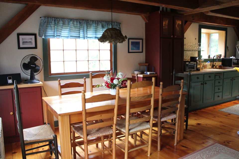 Dining table seats 8, breakfast bar seats 2, and low counter seats 2 little ones