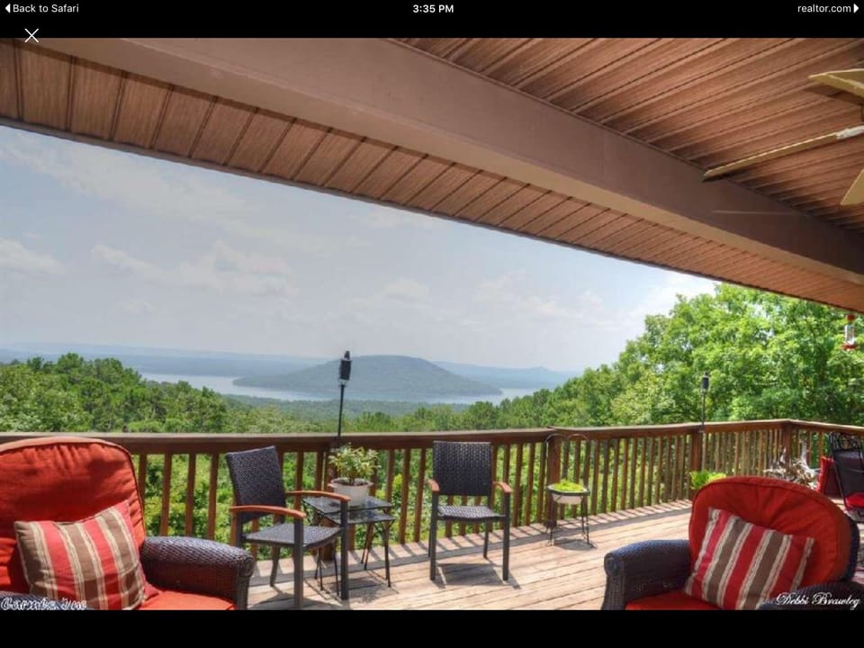 The deck on a sunny day, partially covered so you choose to be in sun or shade!