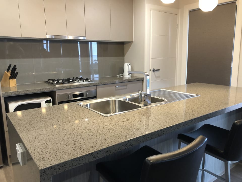 Kitchen work area with  stone benchtops.